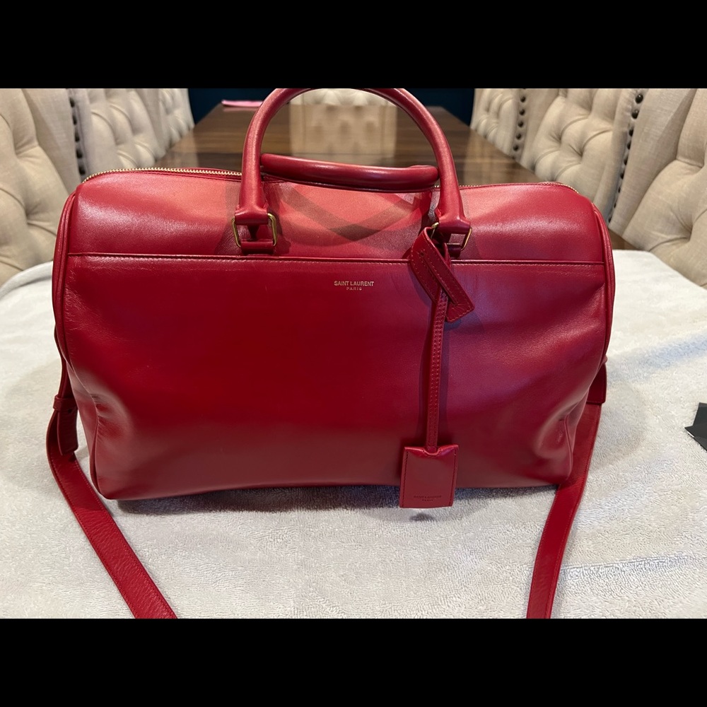 Saint Laurent Classic Duffle 12 Bag in red.